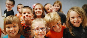 kids with painted faces paws